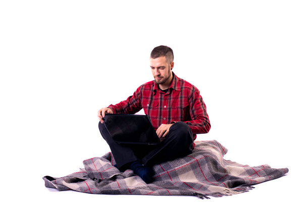 Man works on laptop isolated on white background. Remote work concept, workaholic. - Φωτογραφία, εικόνα