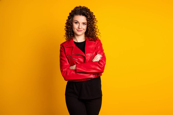Portrait of her she nice pretty fashionable cheery wavy-haired girl folded arms isolated on bright yellow color background - Foto, imagen