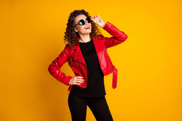 Portrait of her she nice-looking cheerful dreamy fashionable cool wavy-haired girl touching specs isolated on bright yellow color background - Foto, afbeelding