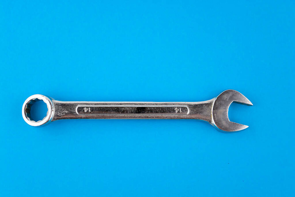 Wrench, spanner isolated blue background - Фото, изображение
