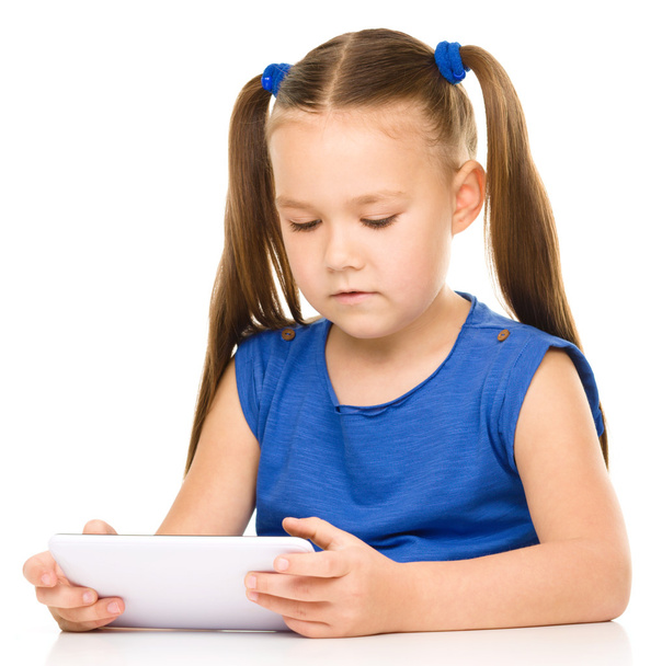 Young girl is using tablet - Photo, image
