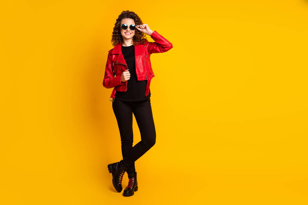 Full length photo of pretty youth girl touch spectacles wear trousers isolated on shine color background - Photo, image