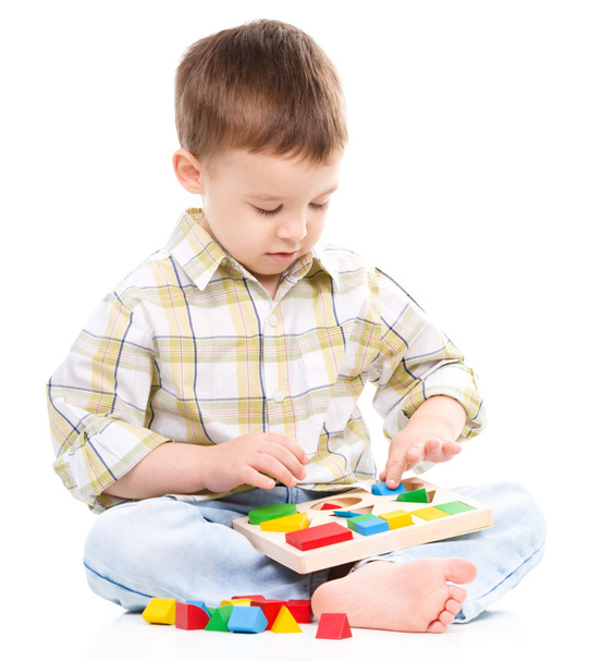 Little boy is playing with toys - Zdjęcie, obraz