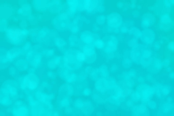 turquoise abstracte gedefocuste achtergrond met cirkelvorm bokeh spots - Foto, afbeelding
