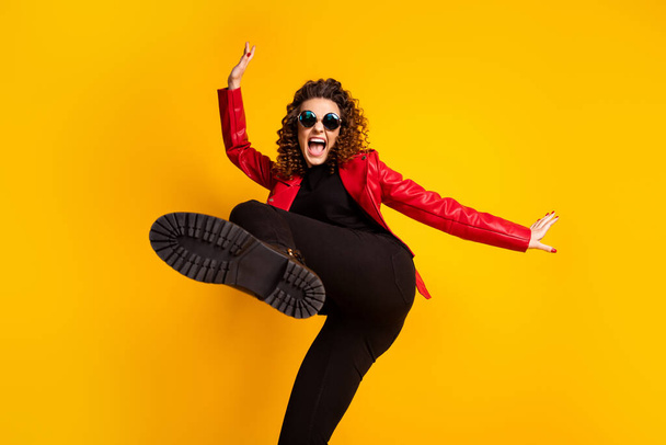 Photo of crazy girl raise leg wear trousers isolated over bright shine color background - Fotó, kép