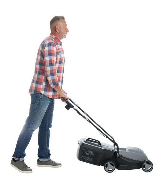 Senior man with modern lawn mower on white background - Foto, imagen