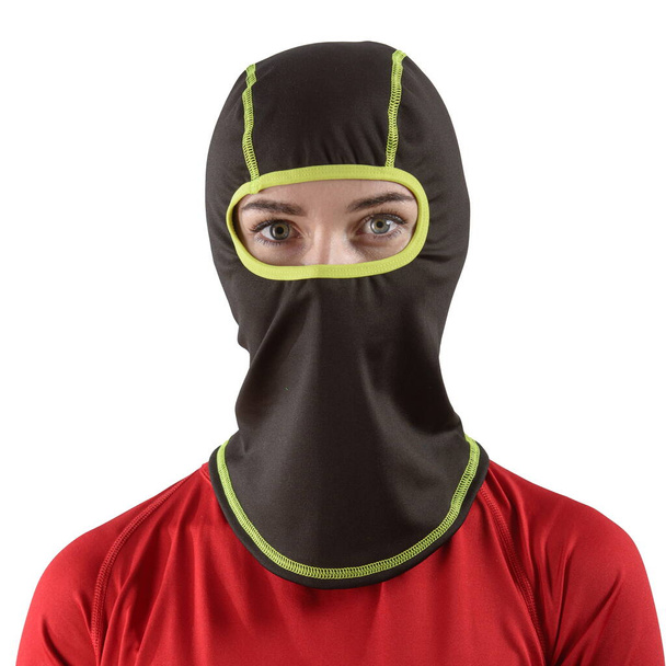 pretty brunette with long hair in a red shirt with a black balaclava with neon green edging - Photo, Image