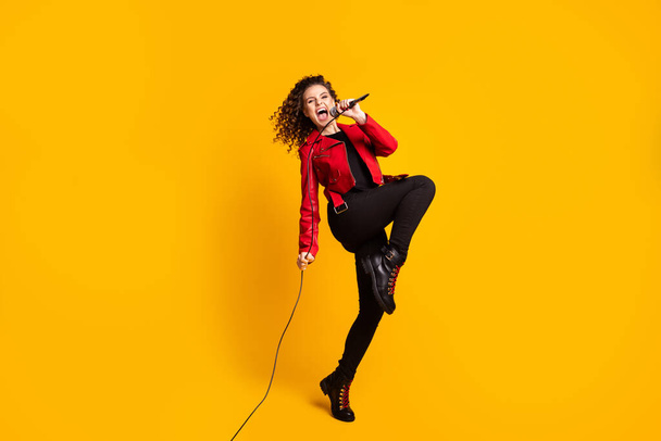 Full length body size view of nice wavy-haired girl vocalist star jumping singing hit having fun isolated on bright yellow color background - Fotoğraf, Görsel
