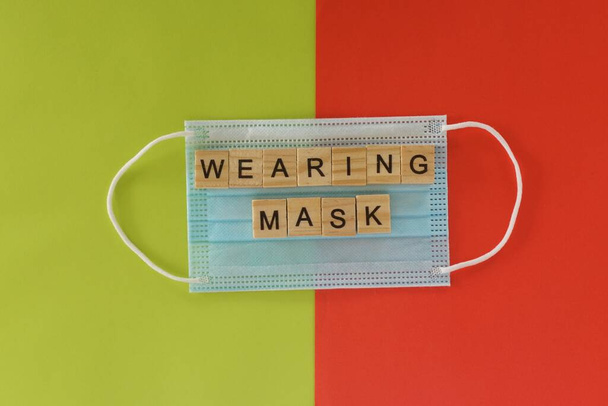 face mask on color background - Foto, immagini