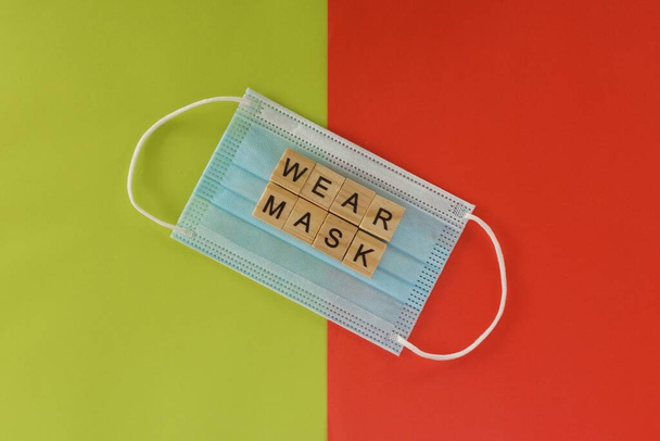 face mask on color background - Photo, Image