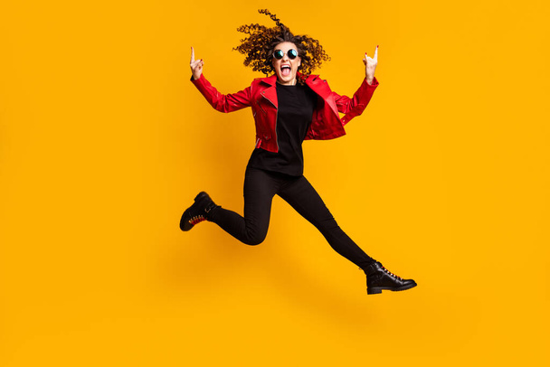Full length body size view of pretty energetic cheerful wavy-haired girl jumping showing horn sign fooling isolated on bright color background - Zdjęcie, obraz