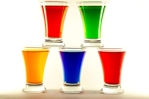 Pyramid from multi-colored shot glasses - Fotografie, Obrázek