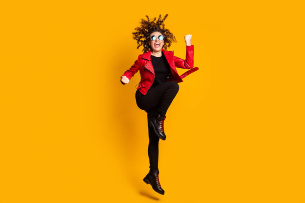 Full length body size view of nice successful lucky cheerful wavy-haired girl jumping rejoicing isolated over bright yellow color background - Fotografie, Obrázek