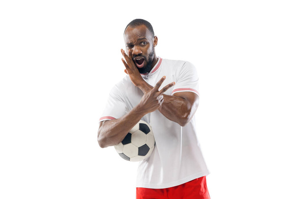 Funny emotions of professional football, soccer player isolated on white studio background, excitement in game - Foto, Bild