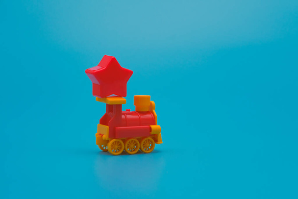 Toy train carrying red star. Customer experience rating minimal concept with copy space - Photo, image