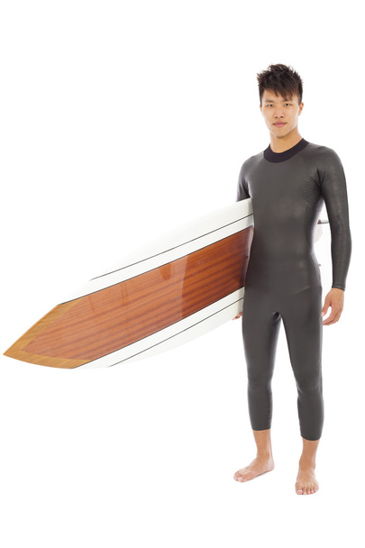 surfing man  holding surfing board in studio - 写真・画像