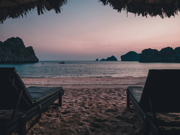 Sun loungers (deck chairs) on the beach, beautiful sunset - Fotografie, Obrázek
