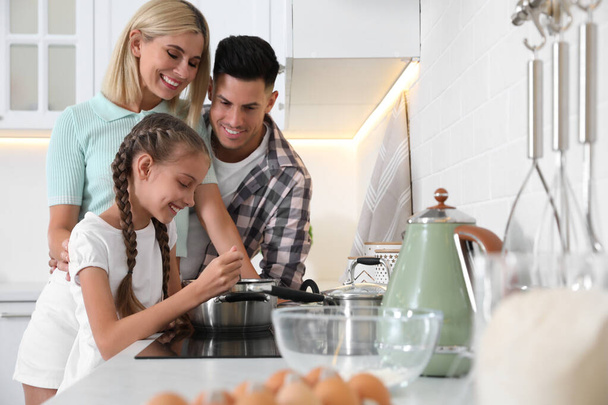 Happy family cooking together in modern kitchen - Foto, Imagem