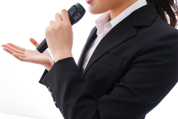 Young businesswoman speaking on the mic - Photo, Image