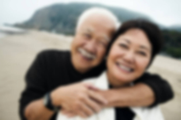 Happy Mature Couple Hugging on Beach - Fotó, kép