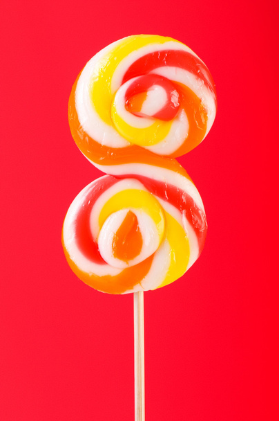 Colourful lollipop against the colourful background - Photo, Image