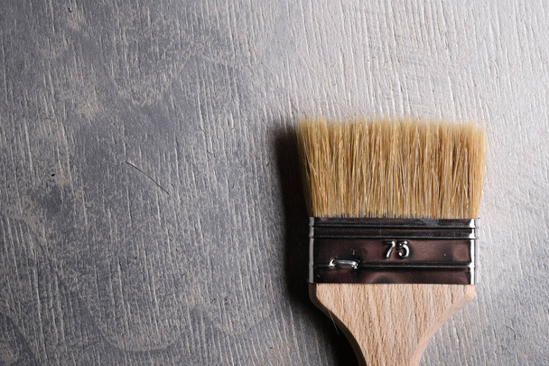 Paint brushes on gray concrete background . Top view - Foto, immagini
