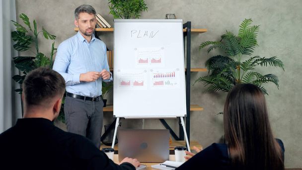 Man and woman listen looking presentation strategy plans achieving targets - Photo, Image