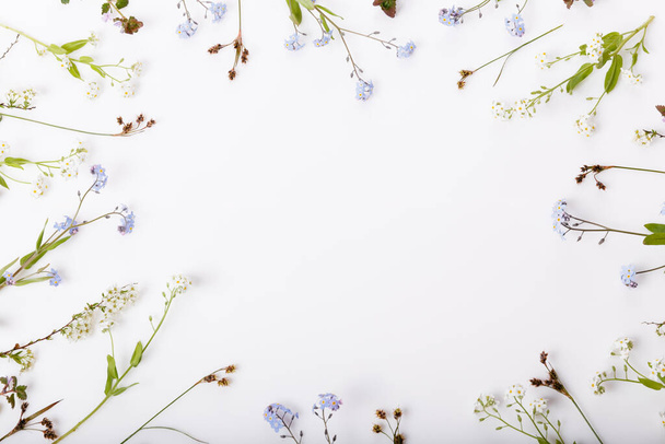 Spring frame of small flowers and forget-me-not, floral arrangement - Photo, Image