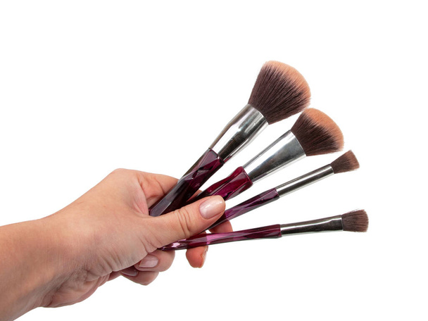 Brushes for make up in hand isolated on the white - Foto, immagini