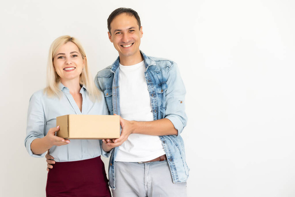 woman and man carry boxes. Start up small business entrepreneur SME or freelance asian woman and man working with box, SME online marketing packaging box and delivery, SME concept - Photo, Image