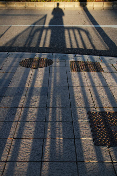 Human shadow in the street - Фото, изображение