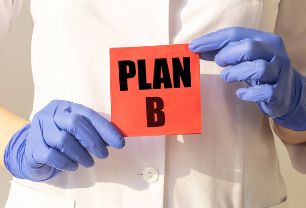 Plan B inscription on paper in doctor hands. - Photo, Image