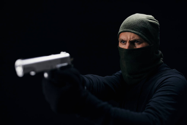 Dangerous offender aiming with real gun - Valokuva, kuva
