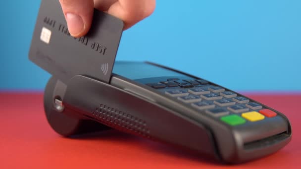 Close up hand, making payment, use terminal to pay account, color background - Footage, Video