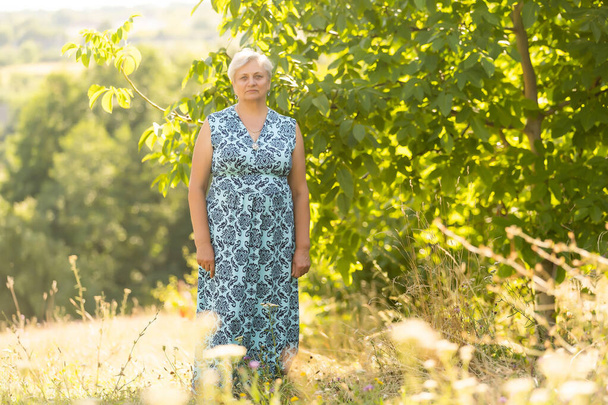Portrait of the elderly woman. A photo on outdoors - Fotografie, Obrázek