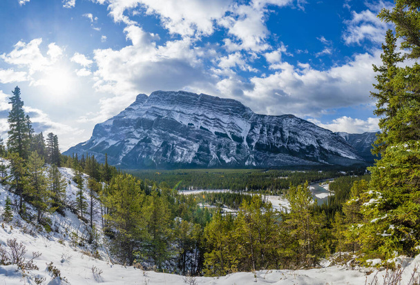 Banff National Park beautiful mountain landscape. Panorama view Mount Rundle valley forest and Bow River in snowy autumn sunny day. Hoodoos Viewpoint, Canadian Rockies. - Photo, Image