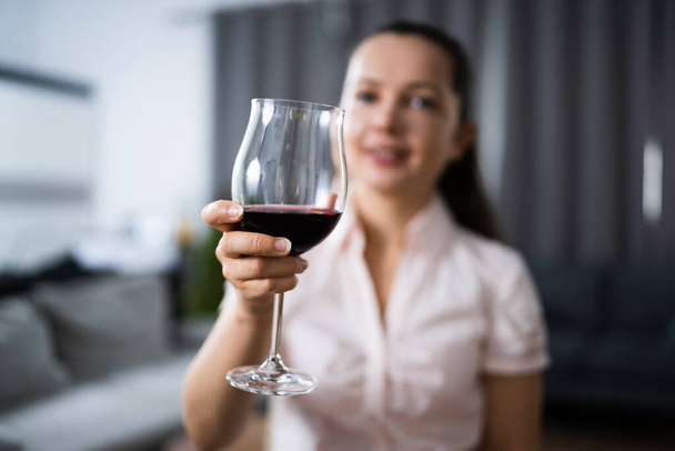 Woman Drinking Red Wine In Video Conference At Home - Foto, Imagem