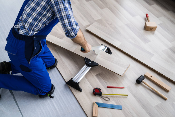 Home Improvement Job. Carpentry Equipment Tool For Laying New Hardwood Floor - Φωτογραφία, εικόνα