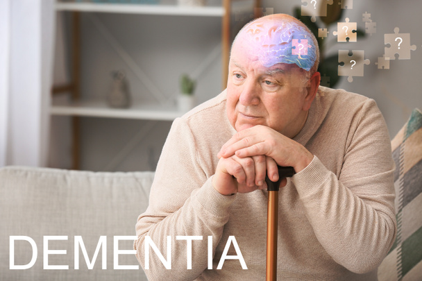 Elderly man suffering from mental disability at home - Foto, imagen