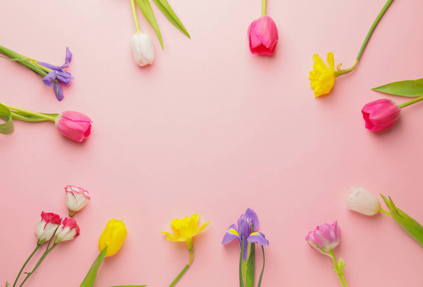 Frame made of beautiful flowers on color background - Photo, Image