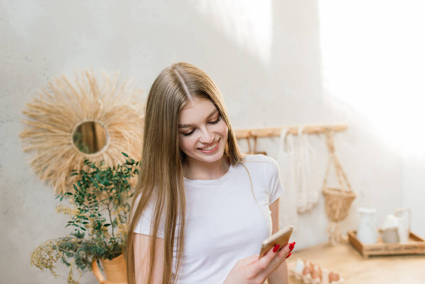 A young woman works in the home office manager or freelancer at work. Distance education. Student woman studying in her room. Online shopping, home work, freelance and online learning concept - Valokuva, kuva
