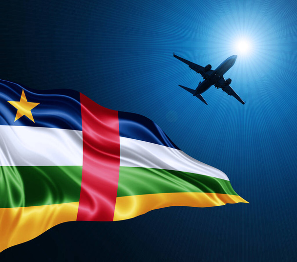 Bandera de seda de la República Centroafricana por la noche con un avión en el fondo del cielo. Ilustración 3D - Foto, imagen