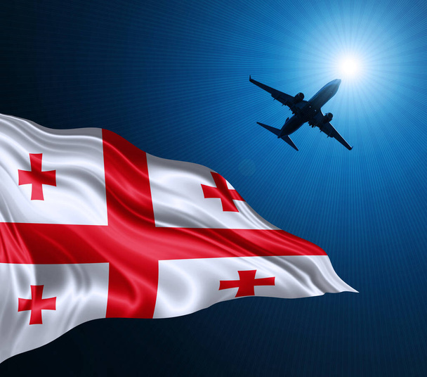 Georgiens Flagge aus Seide bei Nacht mit einem Flugzeug am Himmel. 3D-Illustration - Foto, Bild