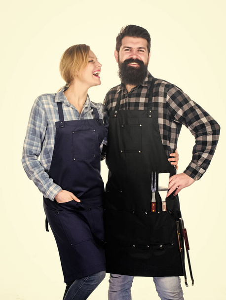 Couple in love getting ready for barbecue. Picnic and barbecue. Man bearded guy and girl ready for barbecue white background. Backyard barbecue party. Family cooking grilled food. Cooking together - Zdjęcie, obraz