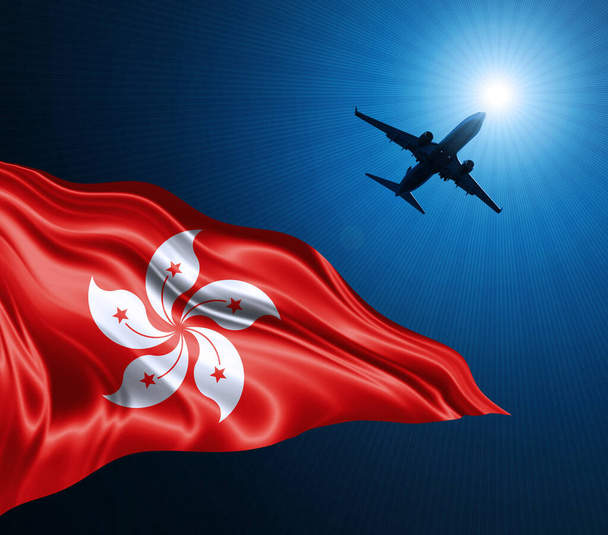 Гонконзький прапор шовку вночі з літаком на небосхилі. 3D ілюстрація - Фото, зображення