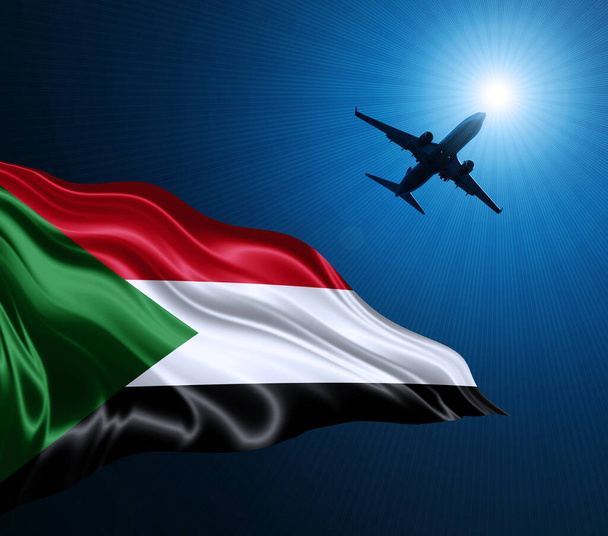 Σημαία του Σουδάν από μετάξι τη νύχτα με ένα αεροπλάνο στο φόντο του ουρανού. 3D απεικόνιση - Φωτογραφία, εικόνα