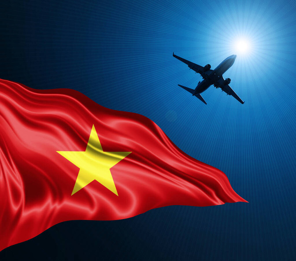 空の背景に飛行機で夜のシルクのベトナム国旗。3Dイラスト - 写真・画像