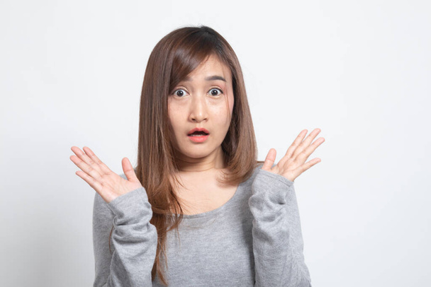 Shocked young Asian woman on white background - Photo, Image