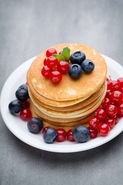 Pancakes. Stack of pancakes with fresh berry. - Фото, зображення
