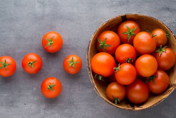 Tomato on the gray background. - Foto, imagen